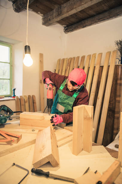 istock female carpenter work in a woodshop 1315118210