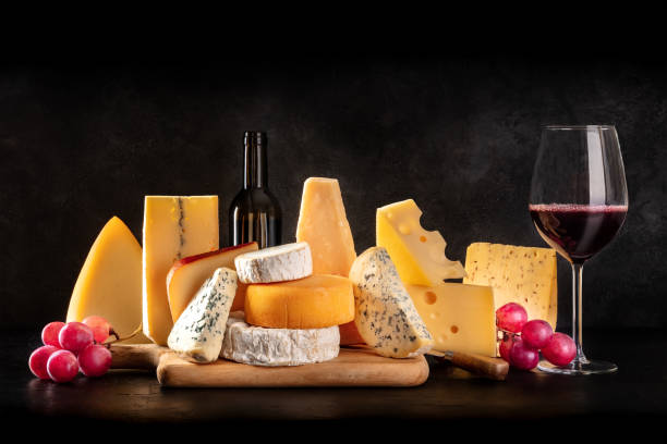 istock Cheese and wine tasting and pairing. A still life with various cheeses 1315118333