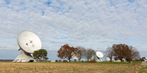 istock Panorama with a satellite dish and trees 1315119746