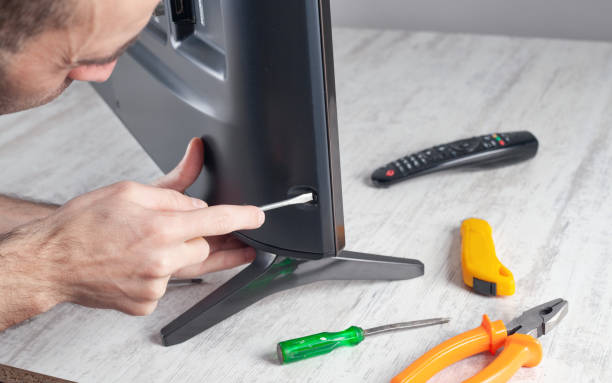 istock Caucasian engineer repairing Tv at home. 1315121897