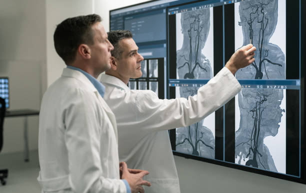 istock Doctors Consult Over An MRI Scan 1315124067