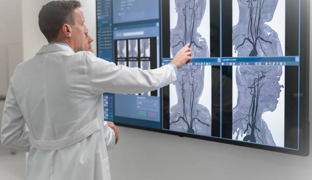 istock Doctors Consult Over An MRI Scan 1315124069