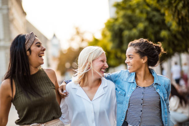 istock Three women walking trough street and talking. 1315127988