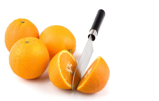 three oranges close-up on a white background, horizontal view, macro