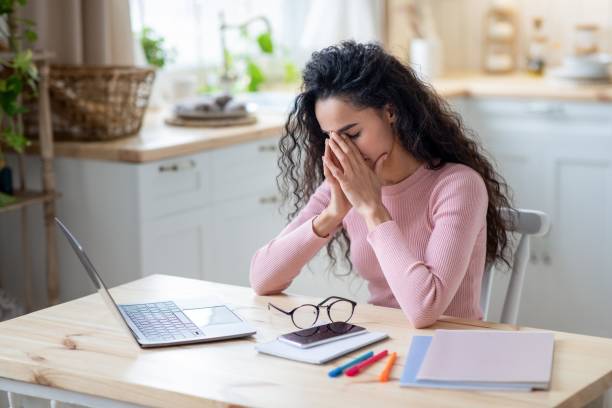 istock Work From Home Fatigue. Exhausted Young Female Tired After Using Laptop 1315131013