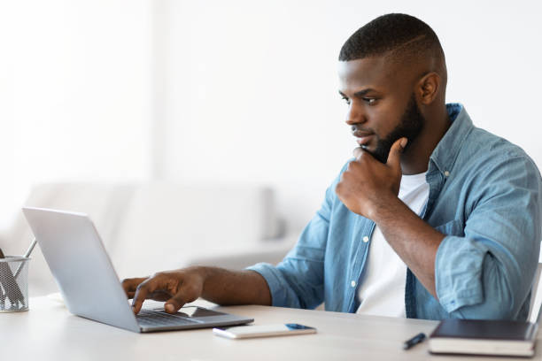 istock Distance Job. Millennial Black Freelancer Guy Working With Computer At Home Office 1315131455