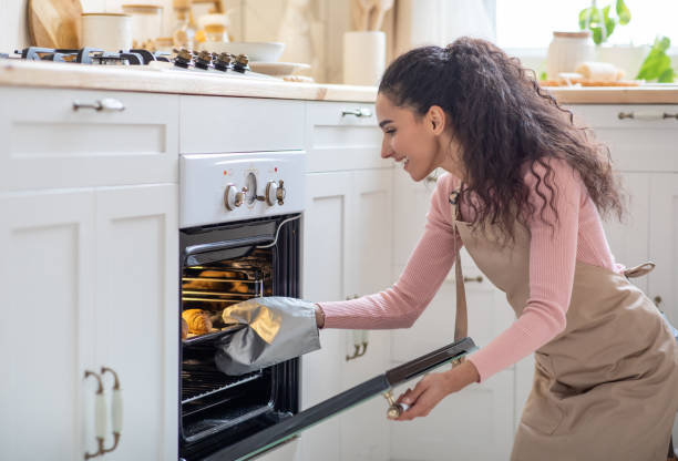 istock Baking At Home. Young Happy Lady Cooking Croissants In Kitchen 1315131842