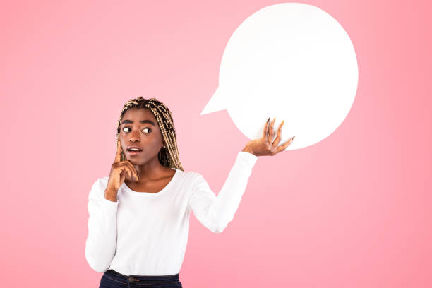 istock Pensive afro woman holding speech bubble at studio 1315133467