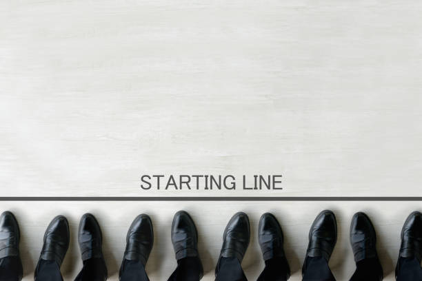 Business team standing by starting line Business team standing by starting line hit the road stock pictures, royalty-free photos & images