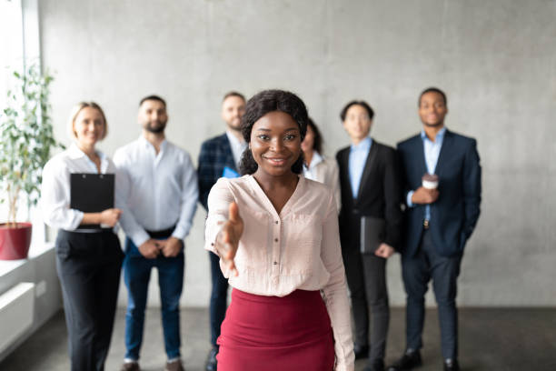 istock Black Business Lady Stretching Hand For Handshake In Office 1315136177