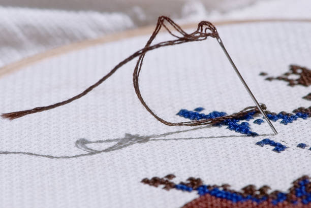 istock Needle stuck in the canvas 1315137840