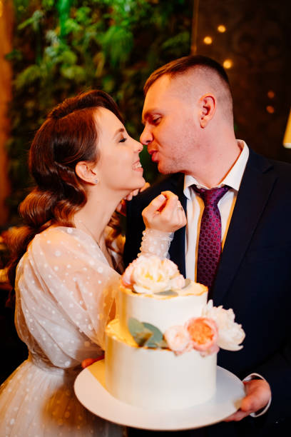 istock Bride and groom with wedding cake. wedding traditions 1315138220