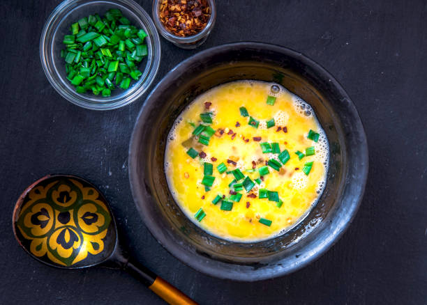 istock Raw beaten eggs in a bowl, for an omelet, before cooking 1315139349