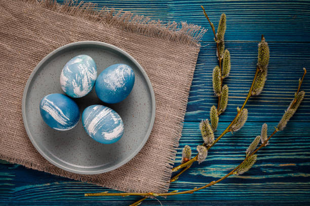 istock marble colored blue and white easter eggs on wooden background 1315139900