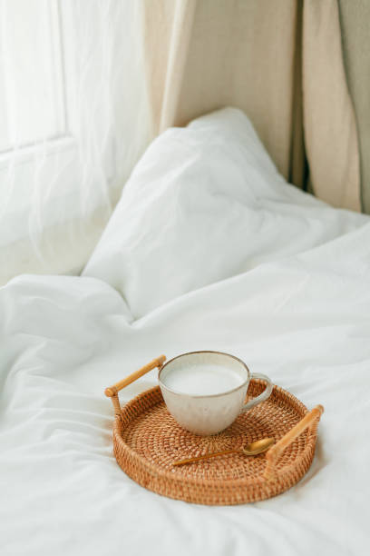 istock Breakfast in bed, cappuccino, wicker tray, spring, home decor. Cozy. 1315140677