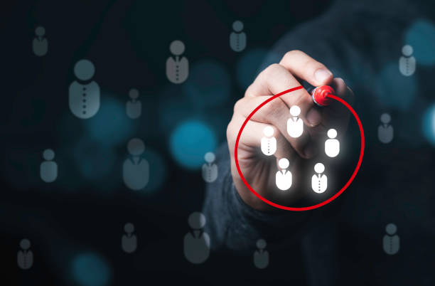 istock Businessman drawing red circle to marking and select human icons , Human development or marketing focus customer target group. 1315143480