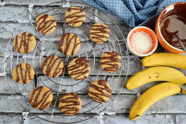 istock Banana coconut cookies drizzled with melted chocolate on cooling rack 1315146555