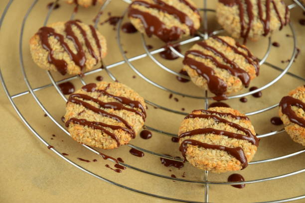 istock Banana coconut cookies drizzled with melted chocolate on cooling rack 1315146575