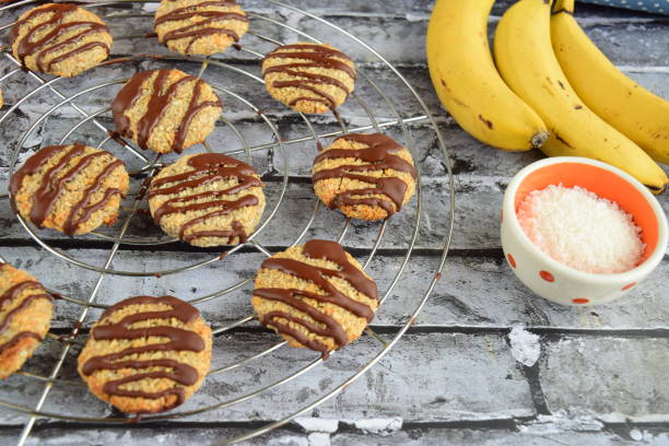 istock Banana coconut cookies drizzled with melted chocolate on cooling rack 1315146599