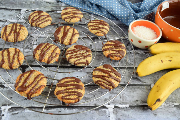 istock Banana coconut cookies drizzled with melted chocolate on cooling rack 1315146608