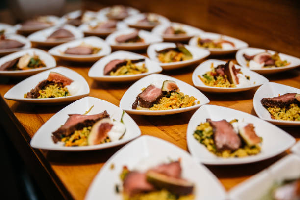 Small bowls with roast beef and couscous on a buffet