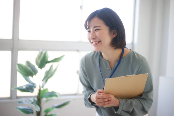istock Female employee with binder 1315147838