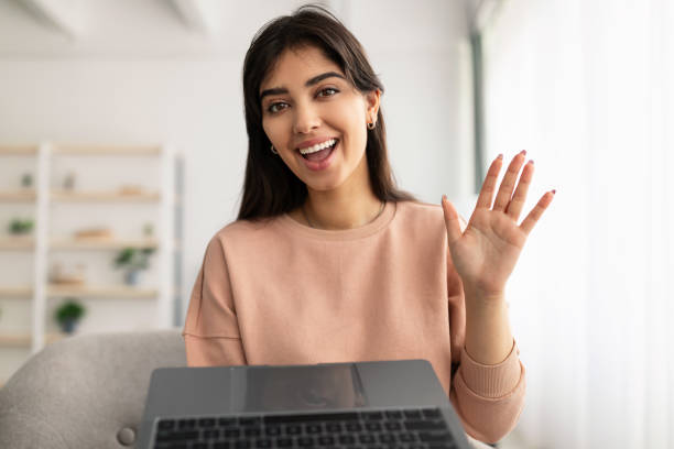 istock Woman having video call using laptop and talking 1315148479