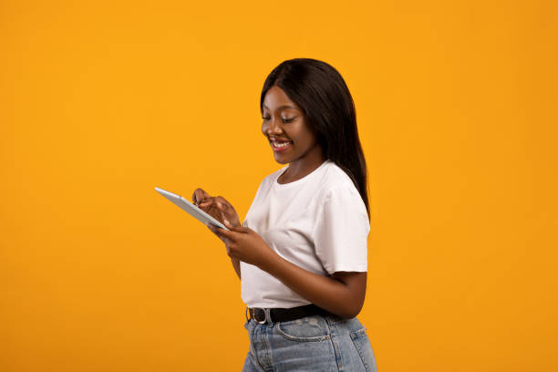 istock Positive black woman with modern digital tablet 1315148510