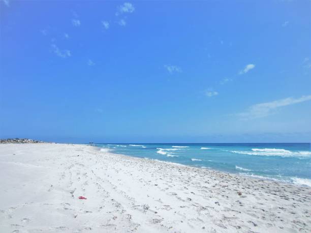 istock blue sky and sea and white beach 1315149016