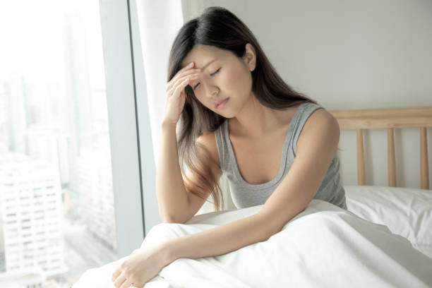 istock Young asian woman self isolating on the bed with flu 1315151821