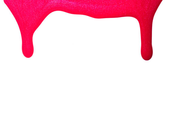 istock Red pink enamel nail polish blot isolated on white background. Makeup varnish sample abstraction 1315152107