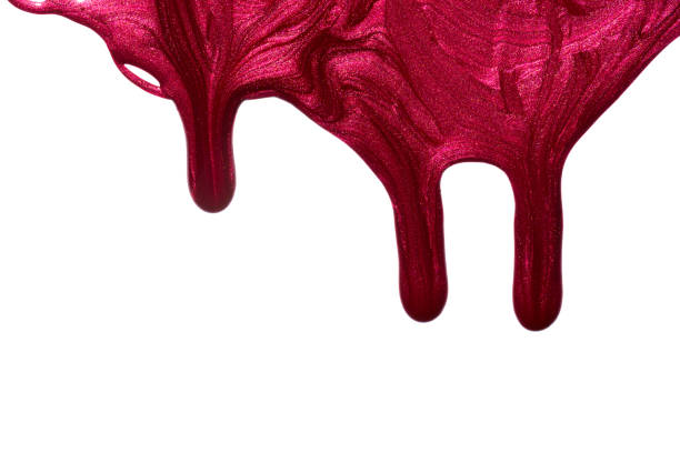 istock Red pink enamel nail polish blot isolated on white background. Makeup varnish sample abstraction 1315152113