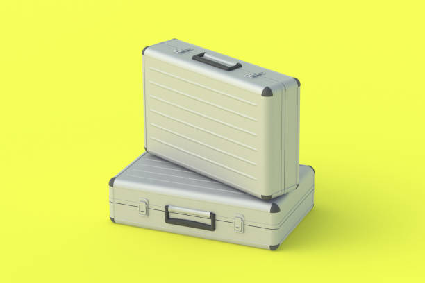 istock Metal suitcases for money or documents on yellow background. 3d render 1315152610
