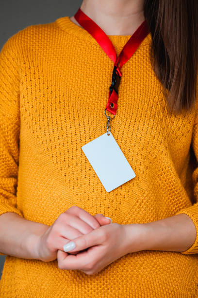 istock Woman holding badge name tag, with blank space mock up 1315154914