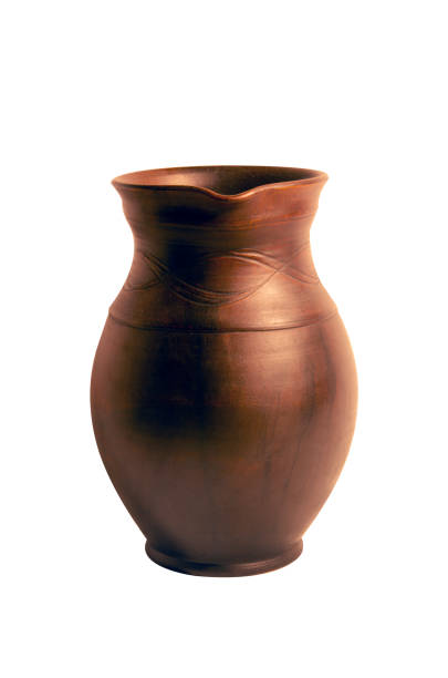 istock Old brown clay pitcher for drinks isolated on a white. 1315154972