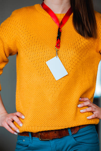 istock Woman holding badge name tag, with blank space mock up 1315155093