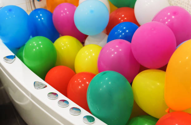 istock The bathtub is filled with colorful balloons. 1315155267