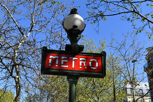 Paris, France-04 26 2021:Paris metro sign outside a subway station in Paris, France.