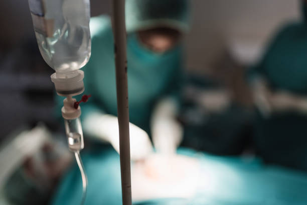 istock Female African - American surgeon operating patient 1315155460