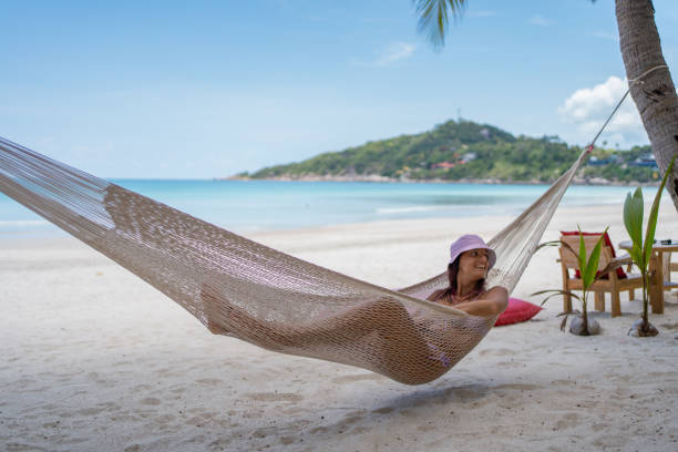 istock Woman relaxing in hammock 1315156431