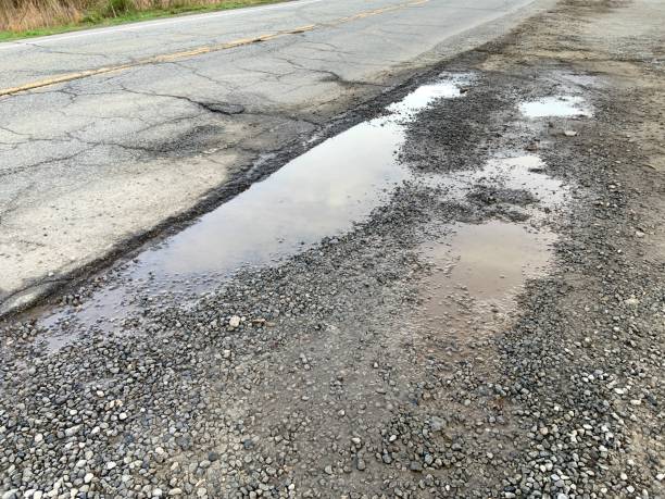 istock Roadside Puddles filled with Rainwater 1315156740
