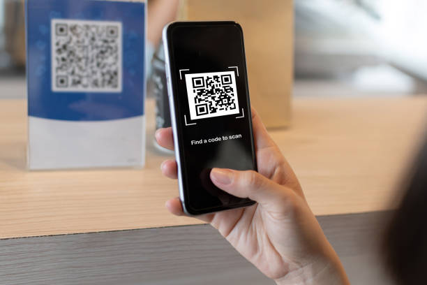 istock customer using digital mobile phone scan QR code pay for buying coffee in cafe coffee shop, restaurant, digital payment, network security, online shopping, takeaway food, internet technology concept 1315157659