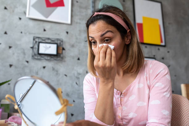 istock Woman sitting removing make up at home 1315158028