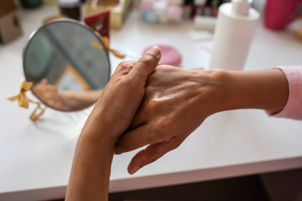 istock Woman applying hand cream on her hand 1315158065