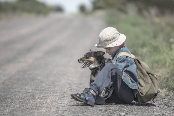 istock child  with dog on a road 1315158150