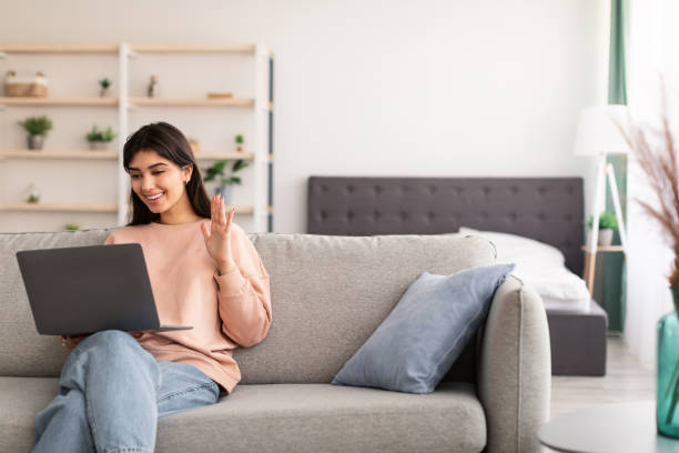 istock Woman having video call using laptop and talking 1315158160
