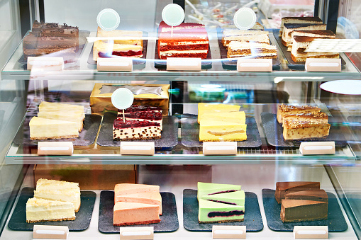 Assortment of cheesecakes on a showcase in a store