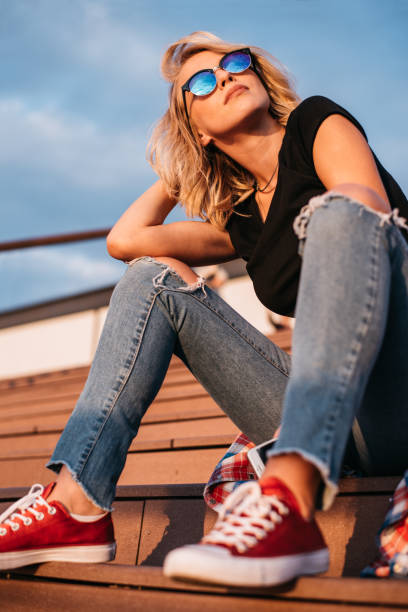 istock Woman sitting on stairs and posing 1315160896