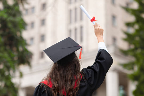 istock Back view of brunette lady in graduation costume 1315160921