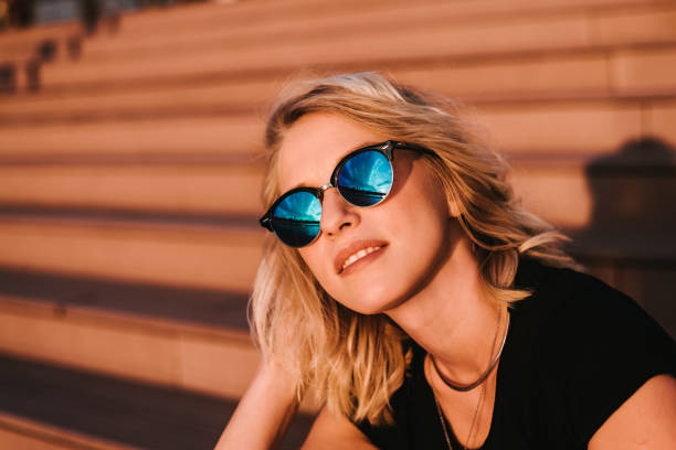 istock Beautiful blondie sitting on stairs at sunset 1315162271